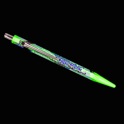 Overhead view of the Caran d’Ache 849 Special Edition Germanier Fluo Green ballpoint pen, showing the slim, elongated silhouette and vivid fluorescent green body.