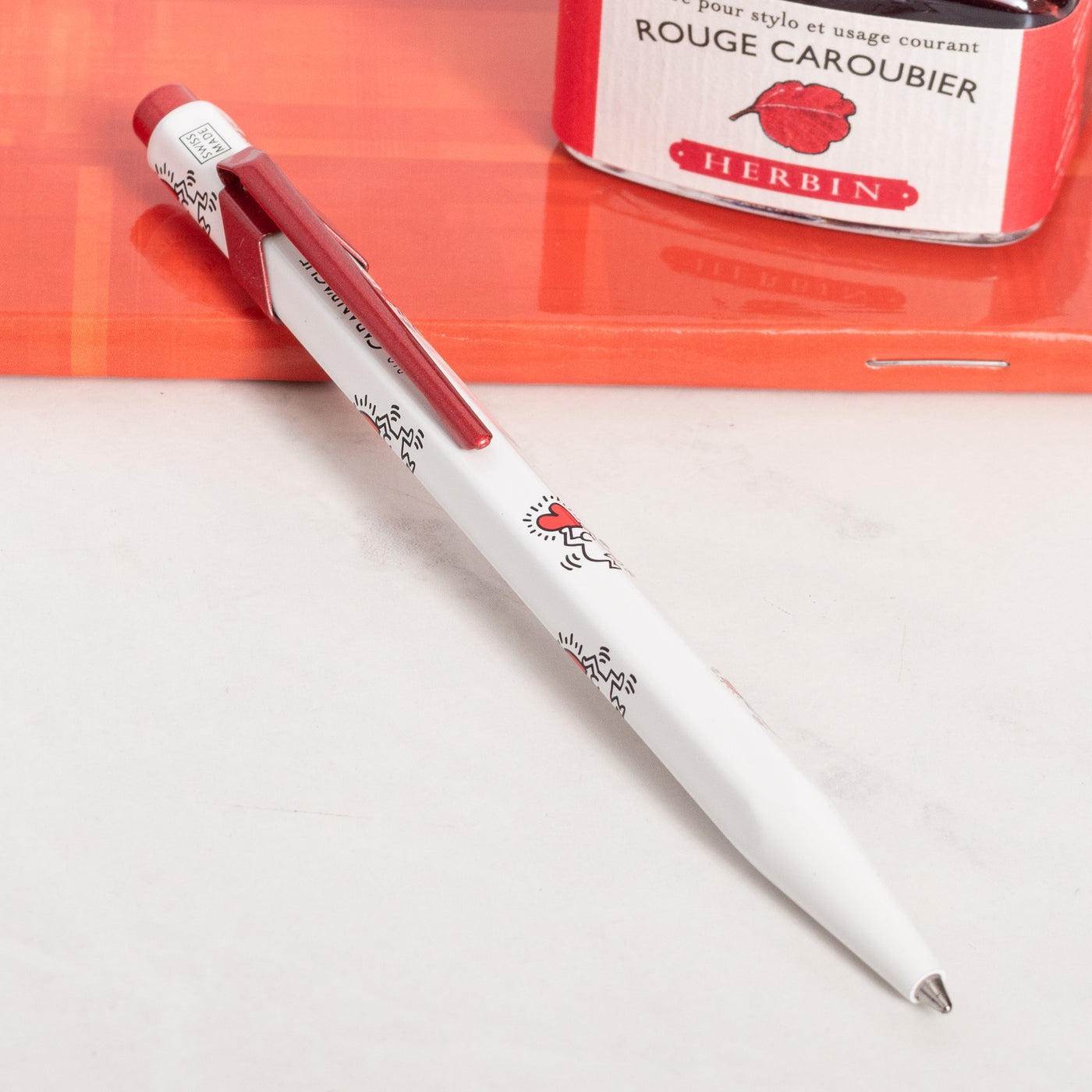 Caran d'Ache 849 Special Edition Keith Haring White Ballpoint Pen red