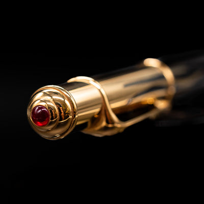Zoomed-in view of the top of the cap with the finial on the Cartier Diabolo Mini Flame Ballpoint Pen - Preowned.