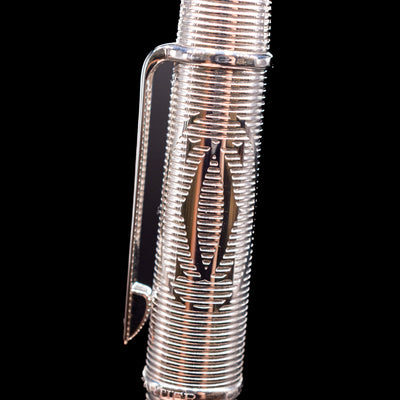 Macro shot of the detailing on the Cartier Diabolo Platinum Double C Logo Ballpoint Pen - Preowned.