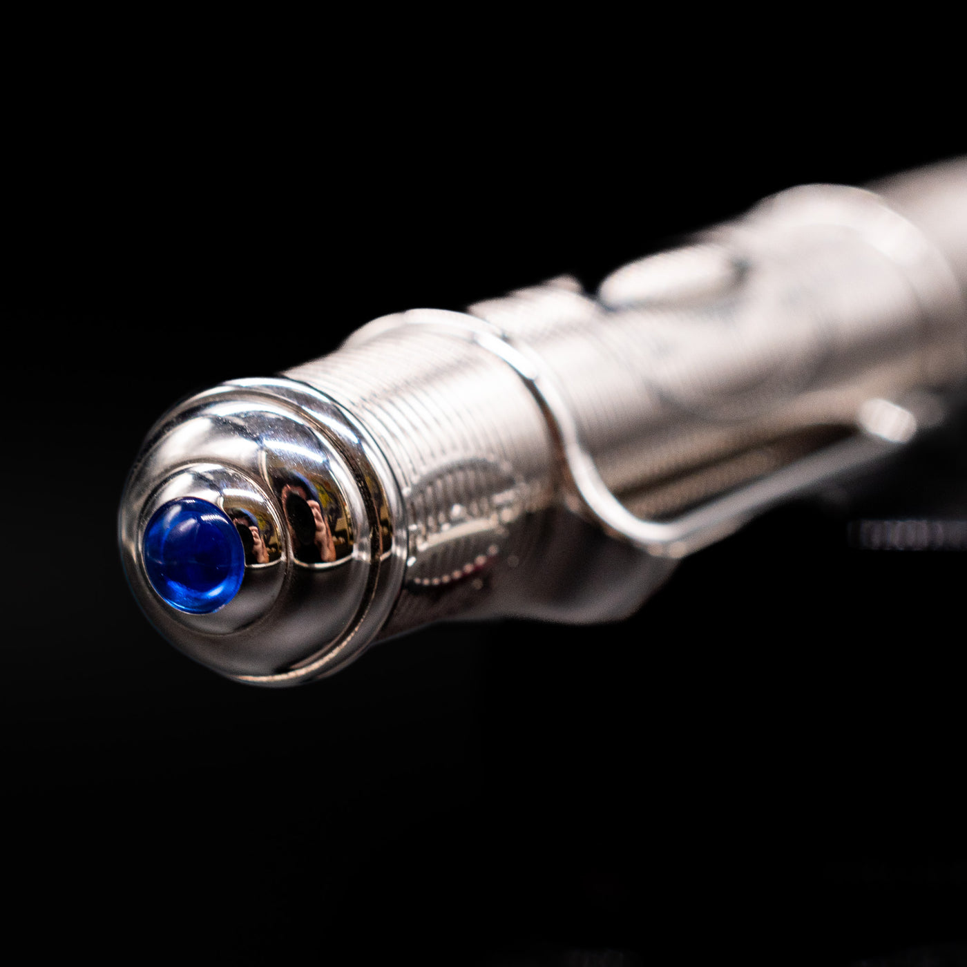 Zoomed-in view of the top of the cap with the finial on the Cartier Diabolo Platinum Double C Logo Ballpoint Pen - Preowned.