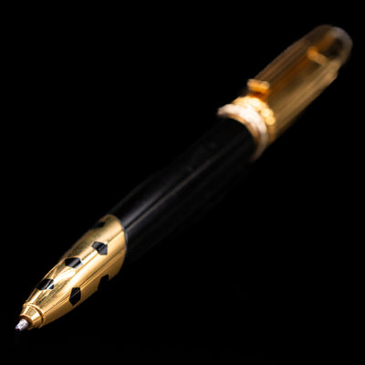 A full view of the Cartier Panthere Black Lacquer Ballpoint Pen - Preowned with a focus on the tip.