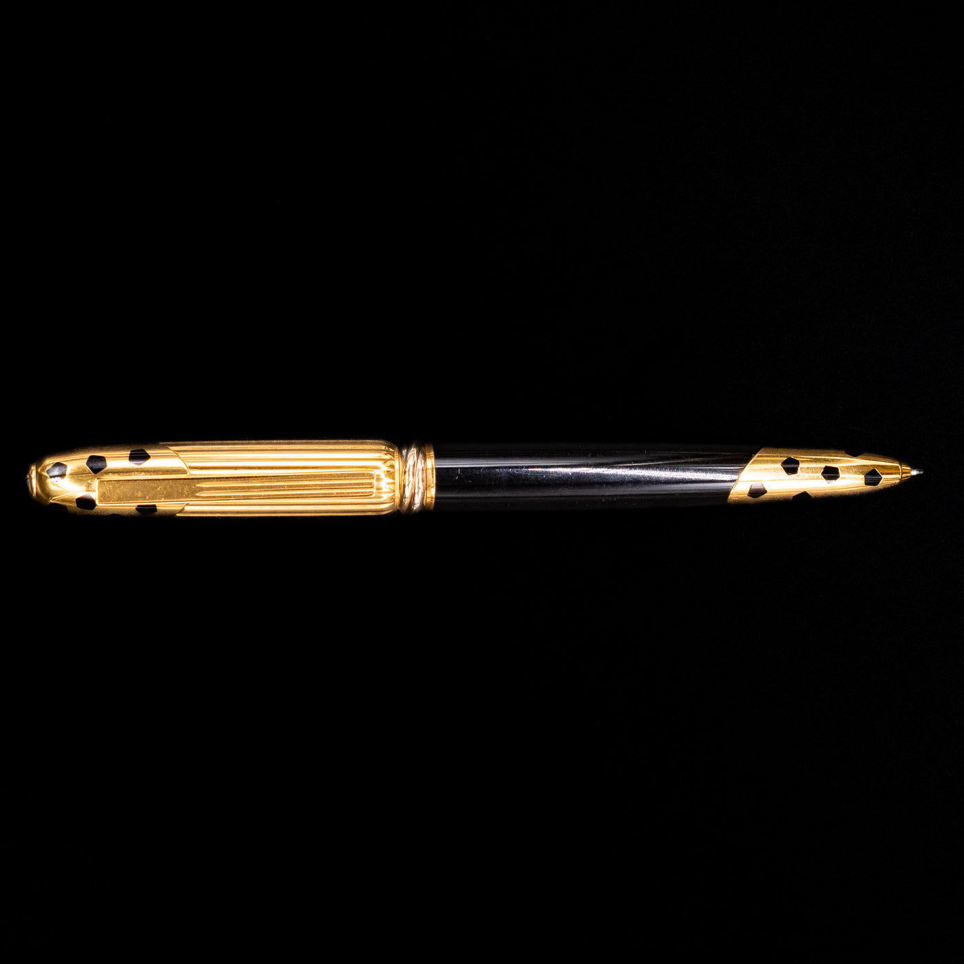 An overhead view of the Cartier Panthere Black Lacquer Ballpoint Pen - Preowned.