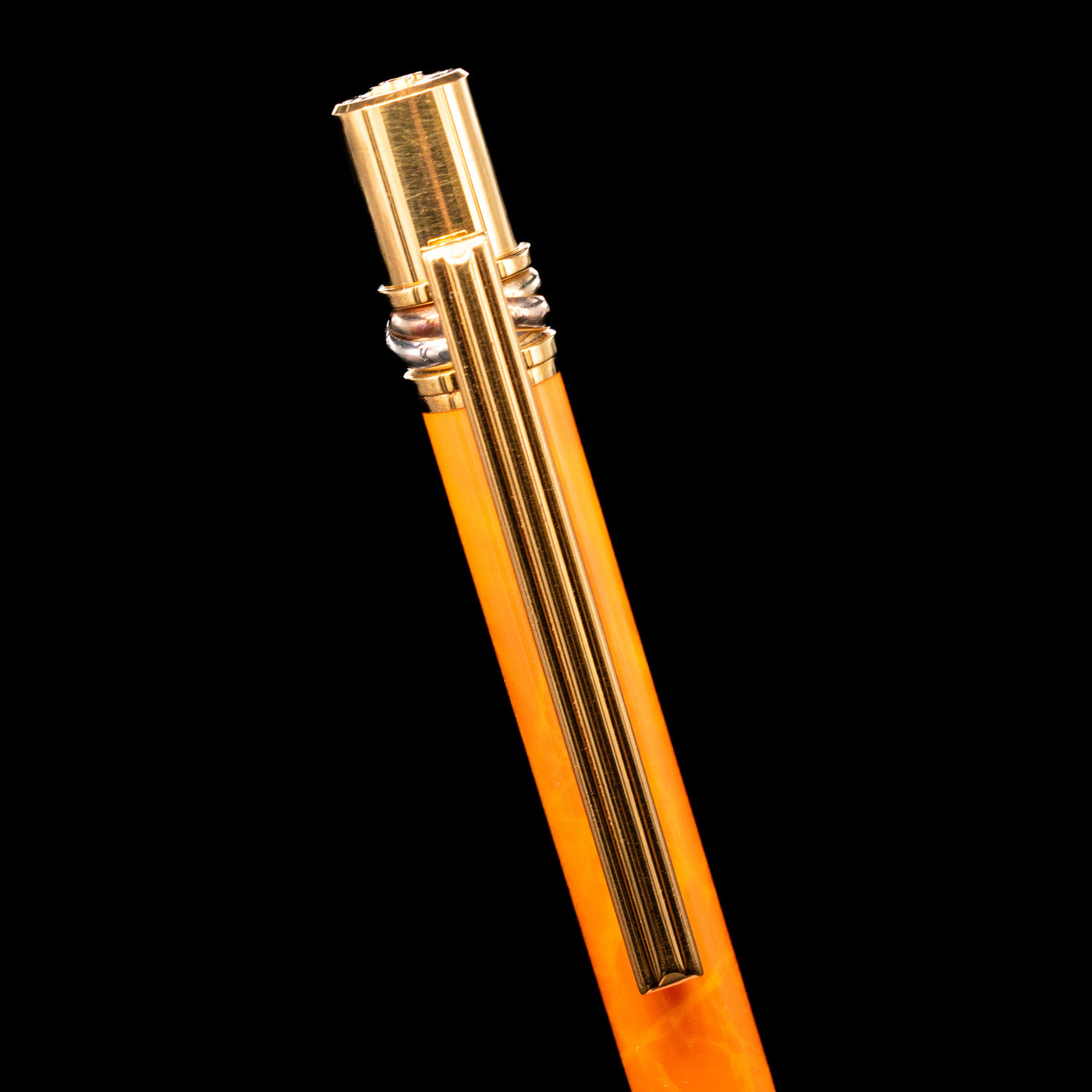  Close-up view of the clip on the Cartier Trinity Orange Mechanical Pencil - Preowned.
