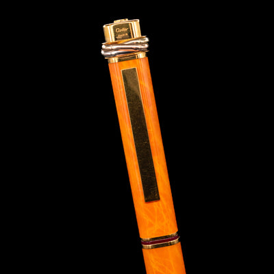  Close-up view of the cap and clip on the Cartier Vendome Oval Orange Fineliner Pen - Preowned.