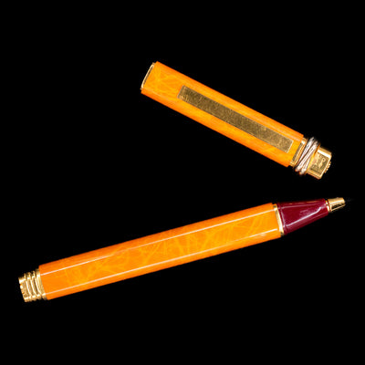 An overhead view of the Cartier Vendome Oval Orange Fineliner Pen - Preowned uncapped.