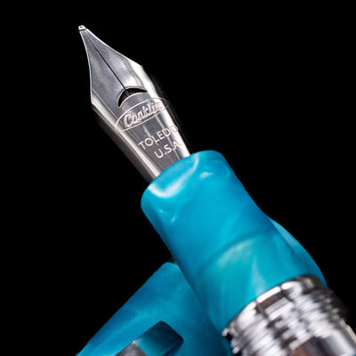 A macro shot of the nib with its intricate detailing and logo engraving for the Conklin 1898 Fountain Pen - Spectra Fusion Blue.