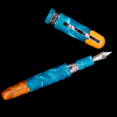 An overhead view of the Conklin 1898 Fountain Pen - Spectra Fusion Blue uncapped.