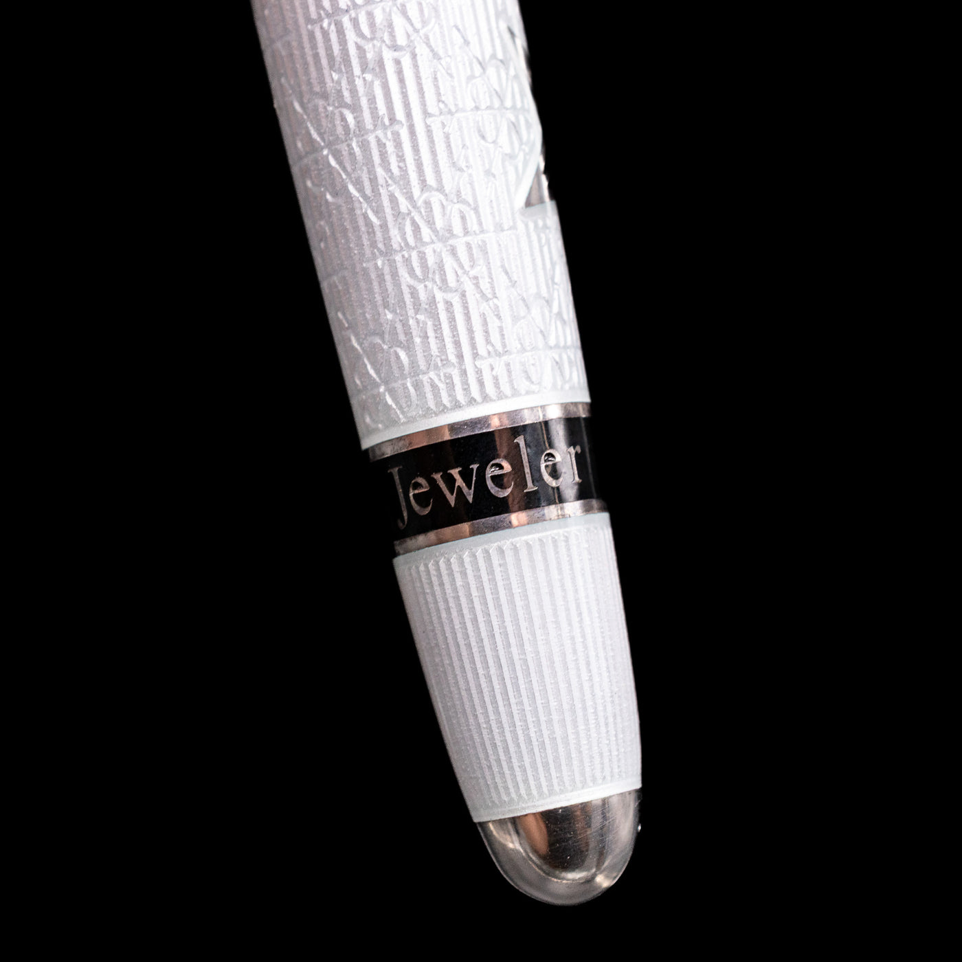 Detail shot of the bottom of the body of the pen showcasing the word "jeweler" on the David Oscarson Black Star & Frost Fountain Pen.
