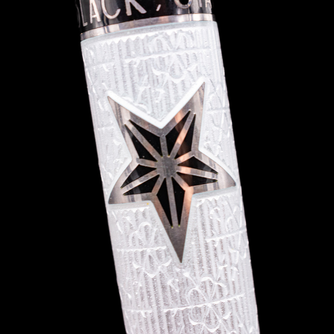 Detail macro shot of one of the stars on the David Oscarson Black Star & Frost Fountain Pen.