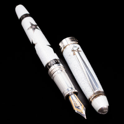 A full view of the David Oscarson Black Star & Frost Fountain Pen uncapped, with its cap laying next to the pen. 