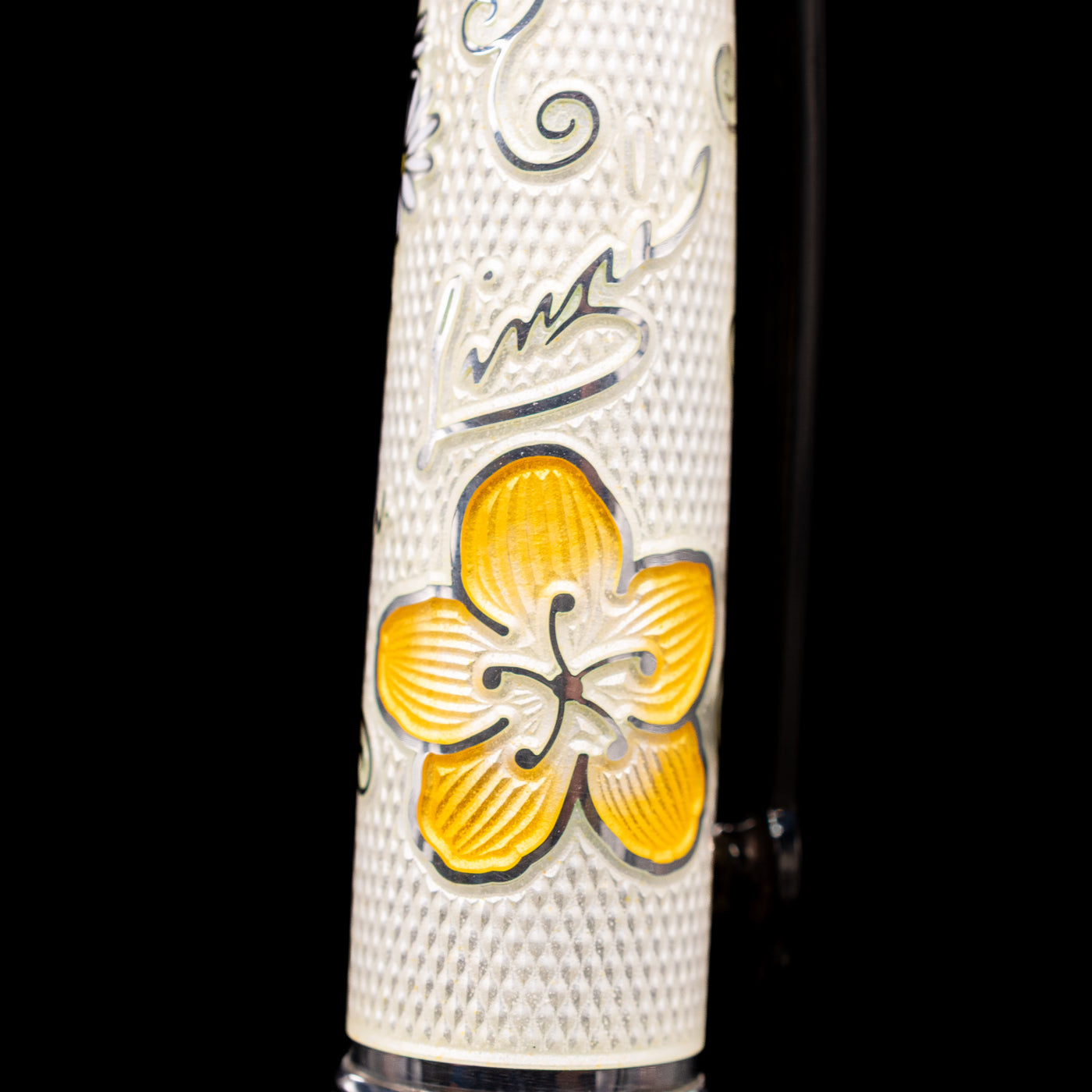 A macro shot of Carl's signature and a flower on the David Oscarson Carl Linnaeus Fountain Pen - White.