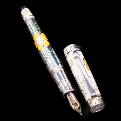 A full view of the David Oscarson Carl Linnaeus Fountain Pen - White uncapped, with its cap laying next to the pen. 