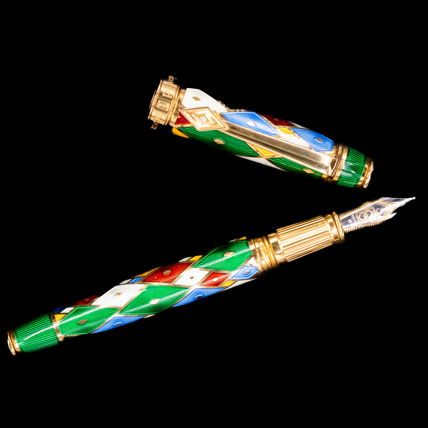 An overhead view of the David Oscarson Harlequin Fountain Pen - Emerald Green uncapped.
