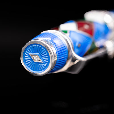 Zoomed-in view of the top of the cap with the finial on the David Oscarson Harlequin Fountain Pen - Sapphire Blue.