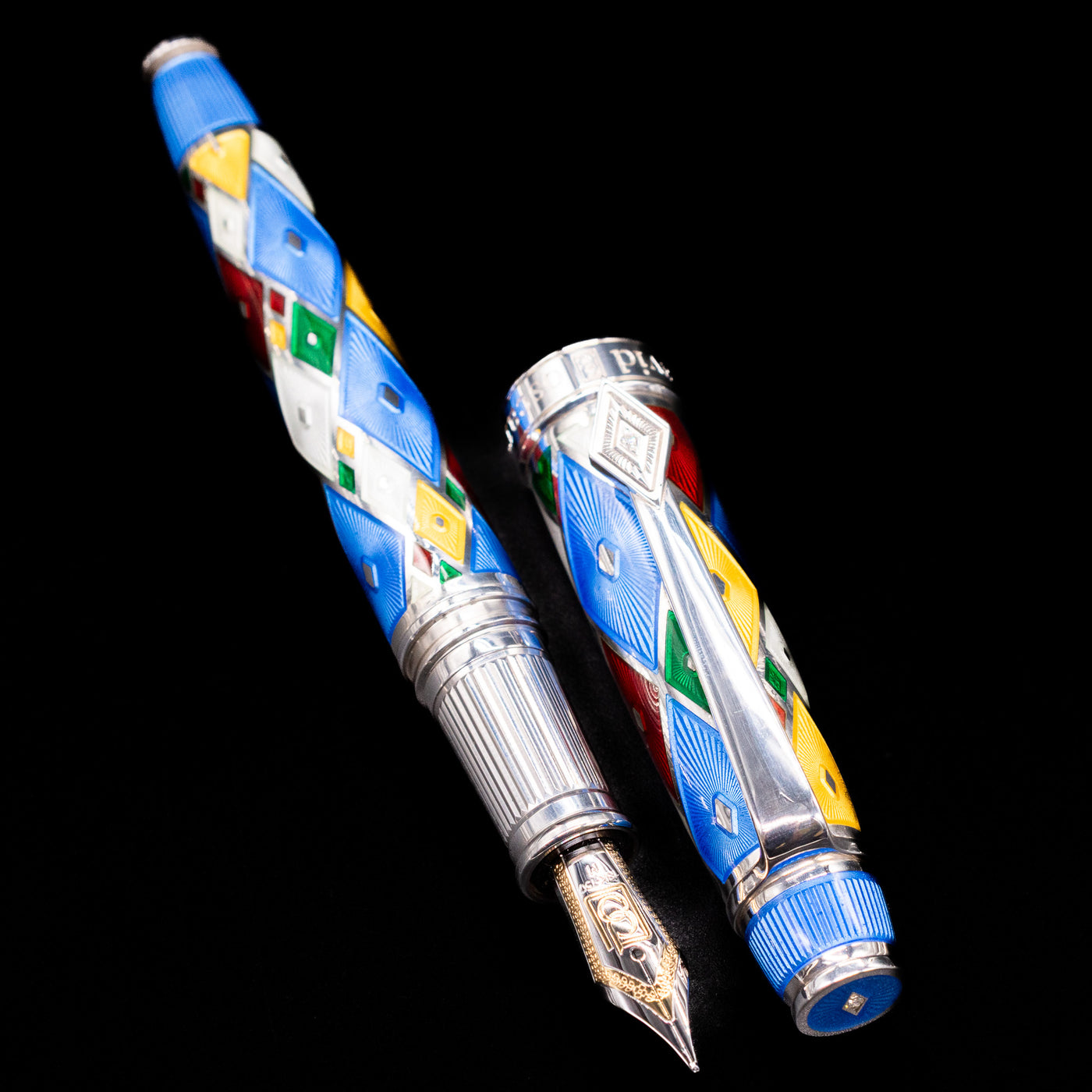  A full view of the David Oscarson Harlequin Fountain Pen - Sapphire Blue uncapped, with its cap laying next to the pen. 