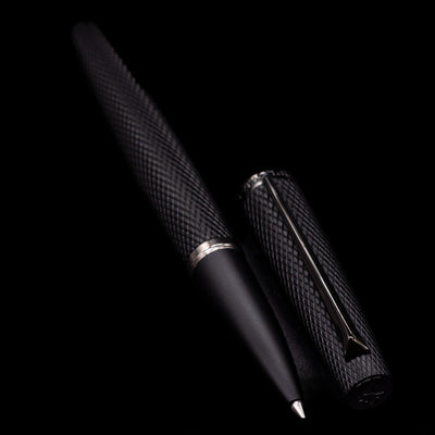 A full view of the Diplomat Viper Rollerball Pen - Black uncapped, with its cap laying next to the pen. 