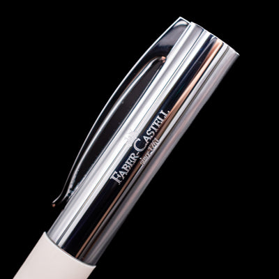 A close-up shot of the logo on the side of the cap on the Faber-Castell Ambition Fountain Pen - Cinematic White.