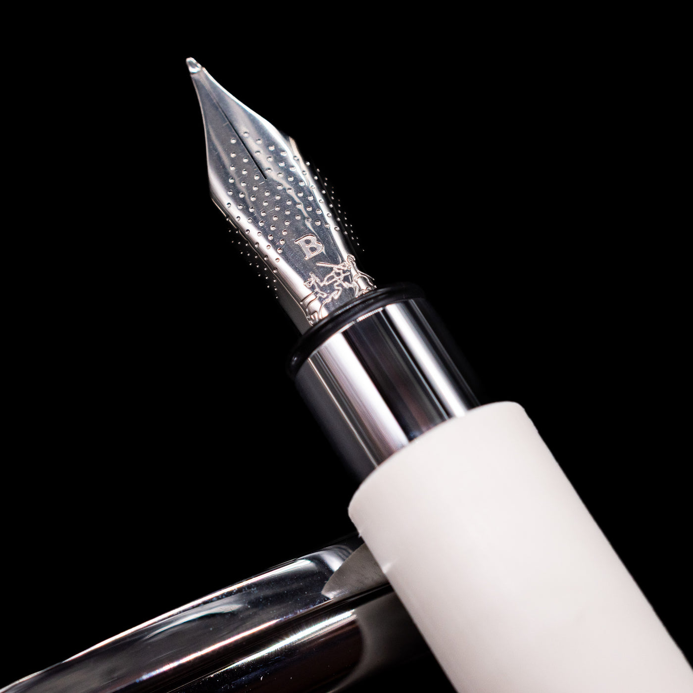 A macro shot of the nib with its intricate detailing and logo engraving for the Faber-Castell Ambition Fountain Pen - Cinematic White.