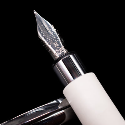 A macro shot of the nib with its intricate detailing and logo engraving for the Faber-Castell Ambition Fountain Pen - Cinematic White.