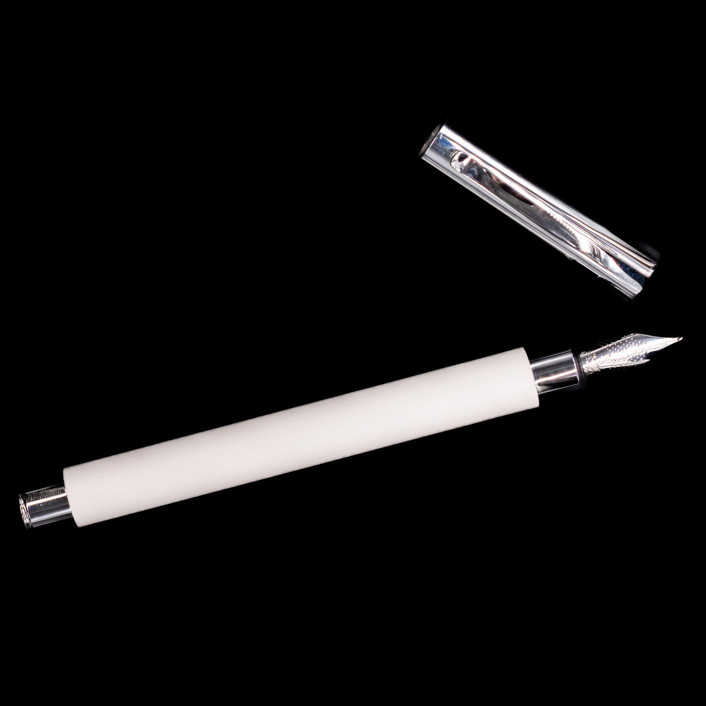An overhead view of the Faber-Castell Ambition Fountain Pen - Cinematic White uncapped.