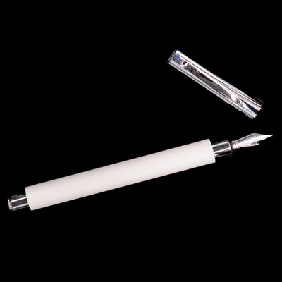 An overhead view of the Faber-Castell Ambition Fountain Pen - Cinematic White uncapped.