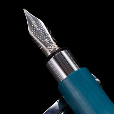 A macro shot of the nib with its intricate detailing and logo engraving for the Faber-Castell Ambition Fountain Pen - Soft Teal (Limited Edition).