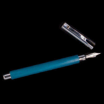 An overhead view of the Faber-Castell Ambition Fountain Pen - Soft Teal (Limited Edition) uncapped.