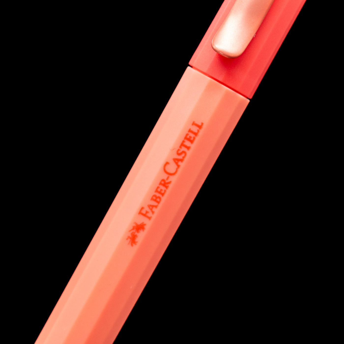 A zoomed-in view of the logo on the body of the Faber-Castell Avori Ballpoint Pen - Inner Fire.