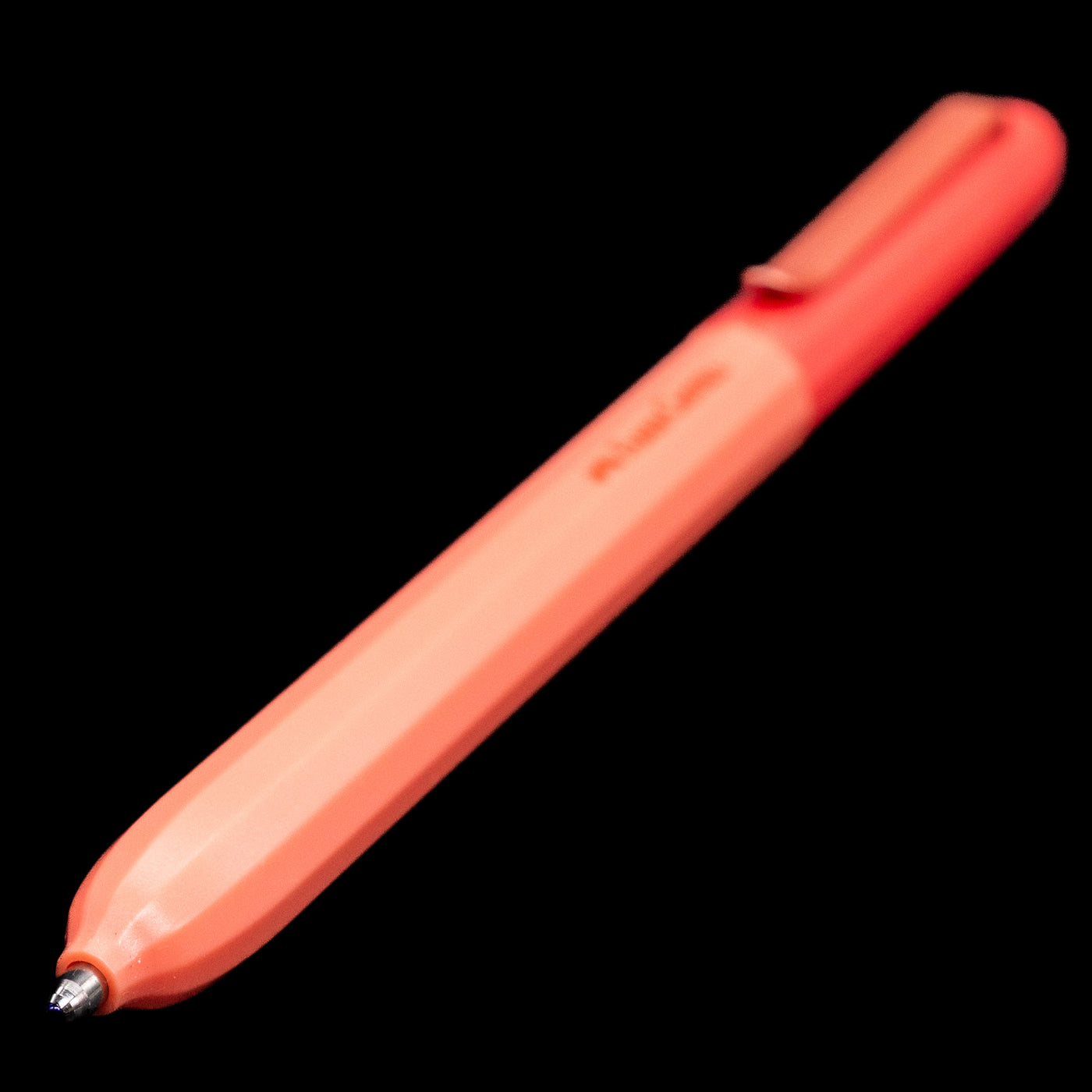 A full view of the Faber-Castell Avori Ballpoint Pen - Inner Fire with a focus on the activated tip.