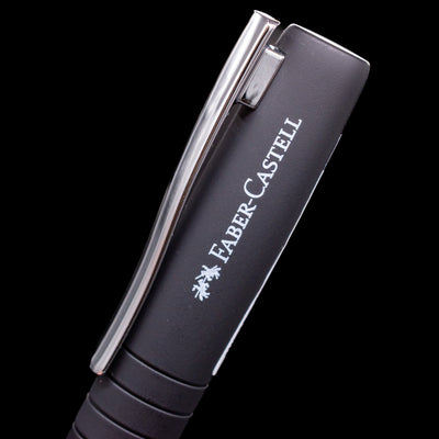 A close-up view of the logo and name of the brand on the side of the cap on the Faber-Castell Poly Fountain Pen - Black.