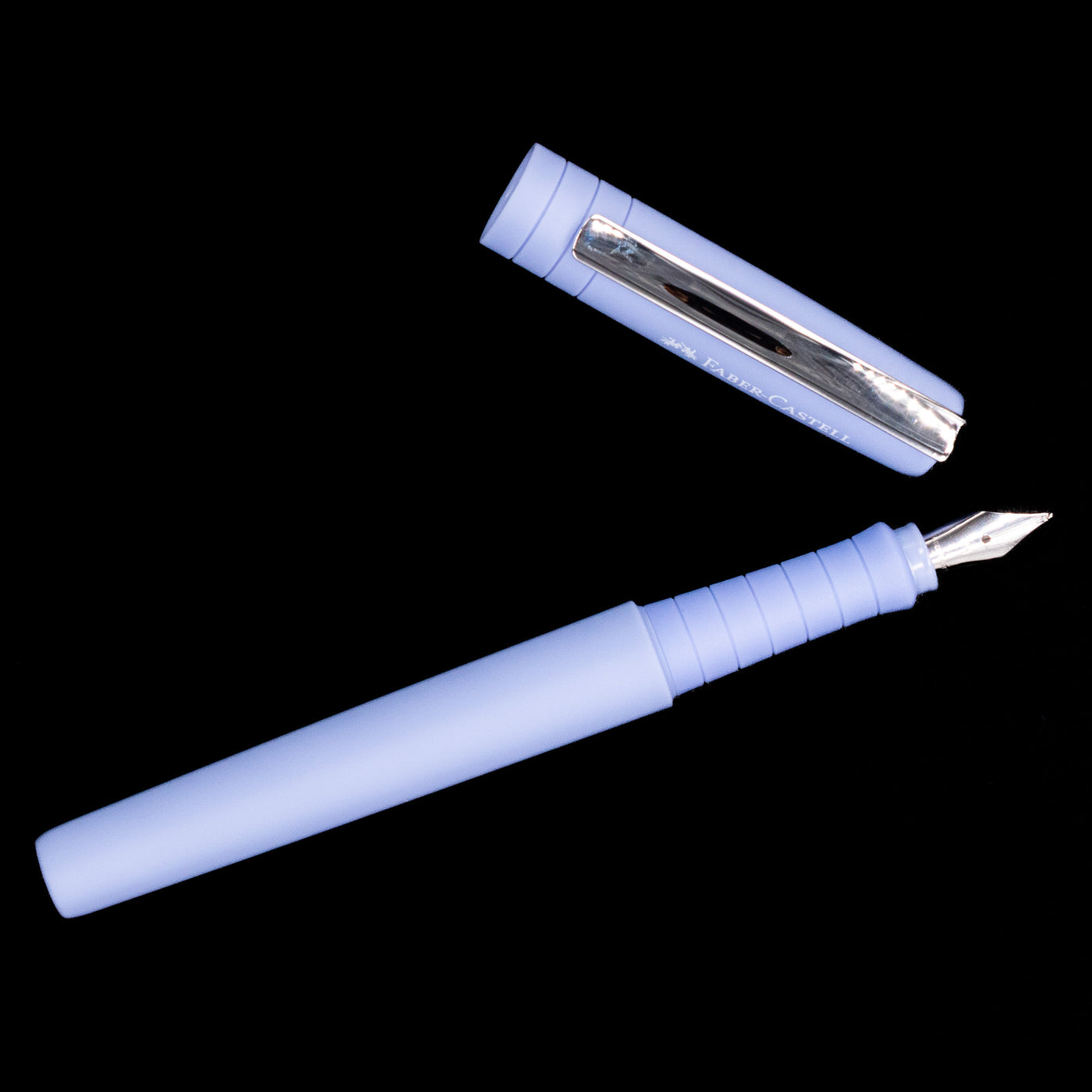 An overhead view of the Faber-Castell Poly Fountain Pen - Caribic Blue uncapped.