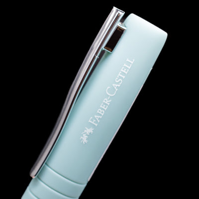 A close-up view of the logo and name brand on the side of the cap of the Faber-Castell Poly Fountain Pen - Iris.