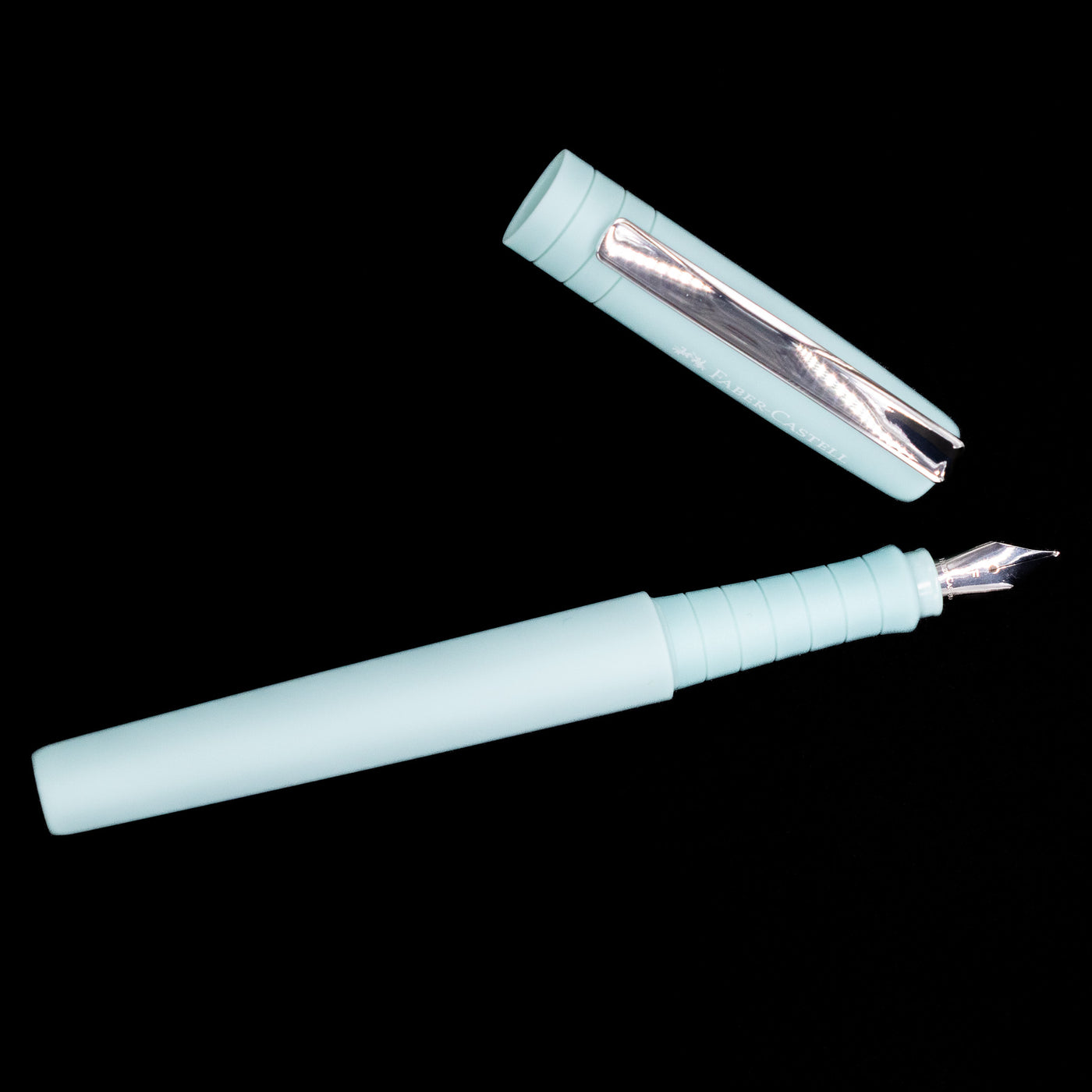 An overhead view of the Faber-Castell Poly Fountain Pen - Iris uncapped.