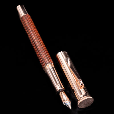 Full view of the uncapped Graf von Faber-Castell Classic Limited Edition fountain pen, revealing the snakewood grain and rose gold trim.