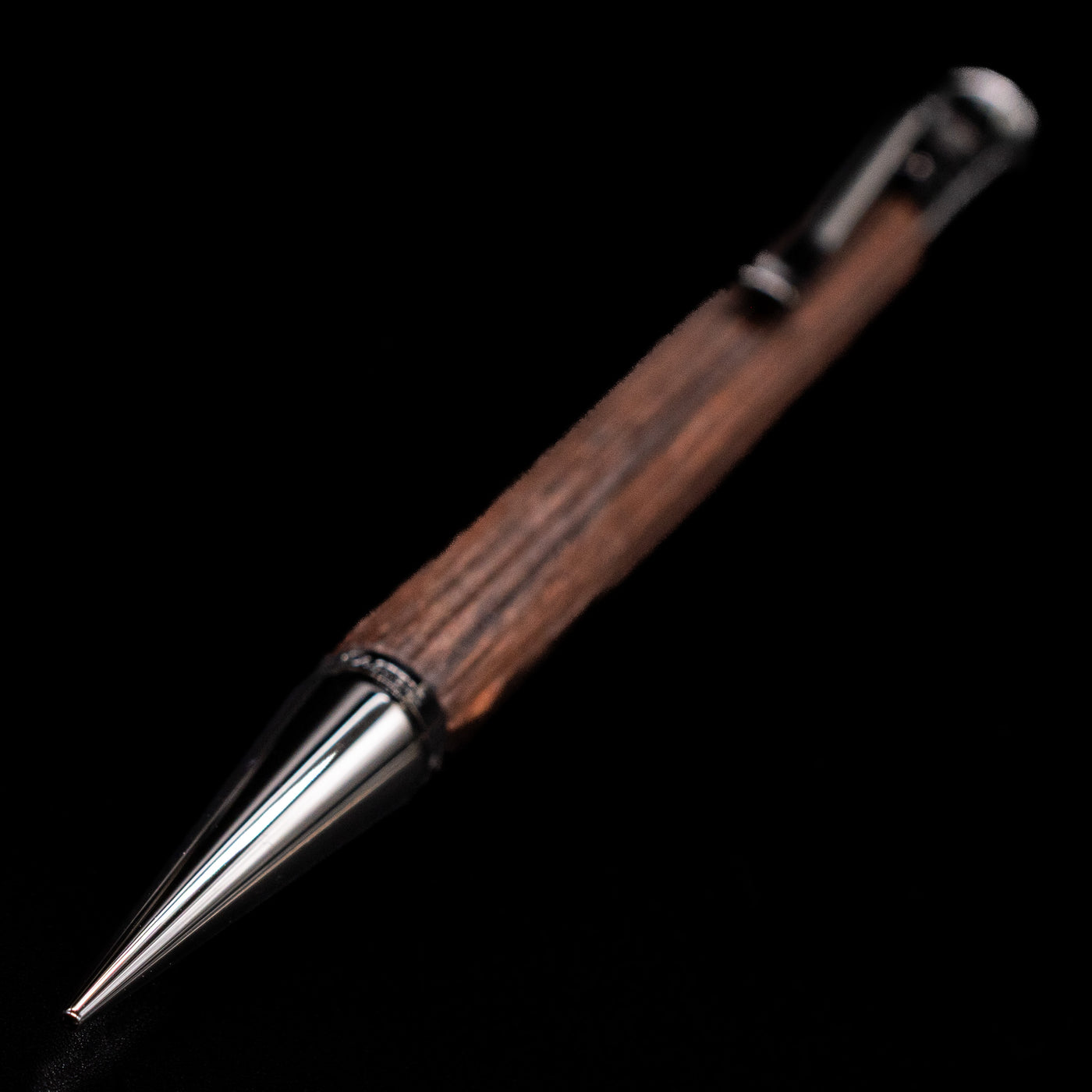A full view of the Graf von Faber-Castell Classic Mechanical Pencil - Macassar Wood with a focus on the nib.