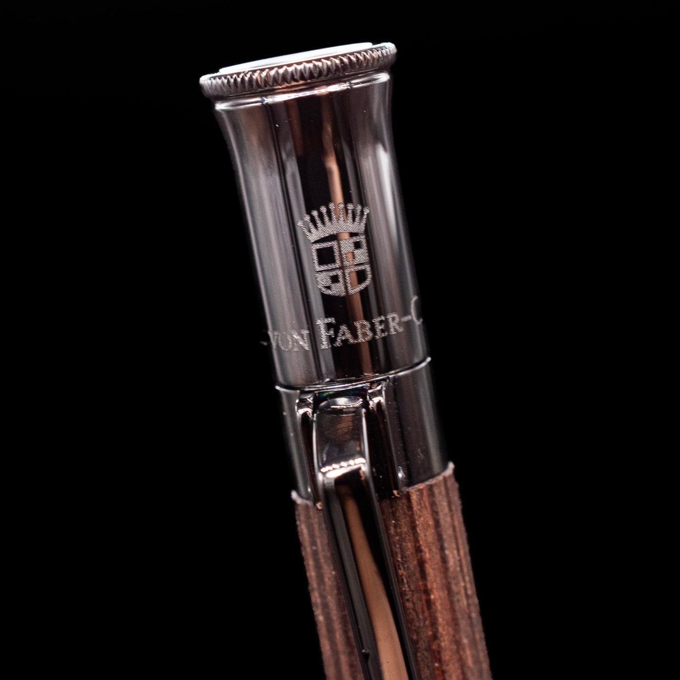 A macro shot of the logo on the cap for the Graf von Faber-Castell Classic Mechanical Pencil - Macassar Wood.