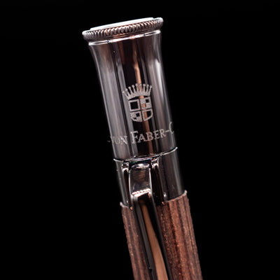 A macro shot of the logo on the cap for the Graf von Faber-Castell Classic Mechanical Pencil - Macassar Wood.