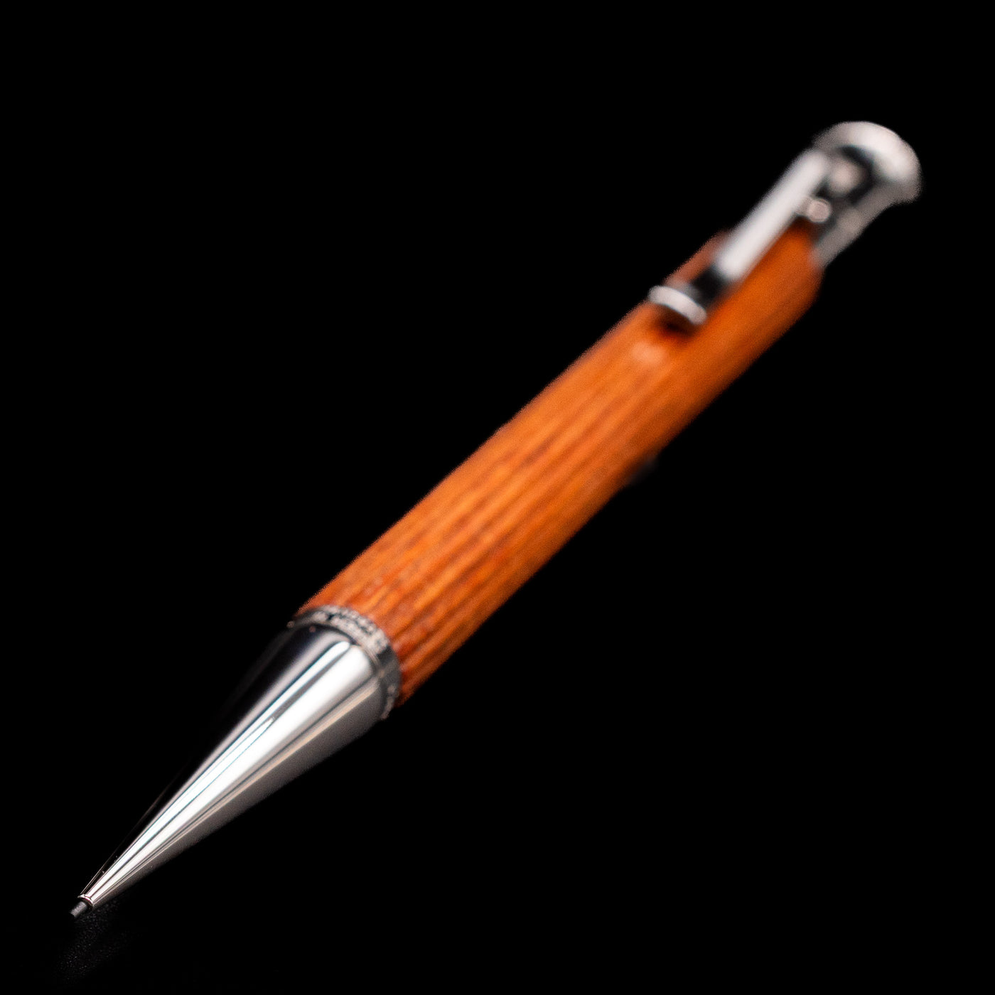 A full view of the Graf von Faber-Castell Classic Mechanical Pencil - Pernambuco Wood with a focus on the tip.