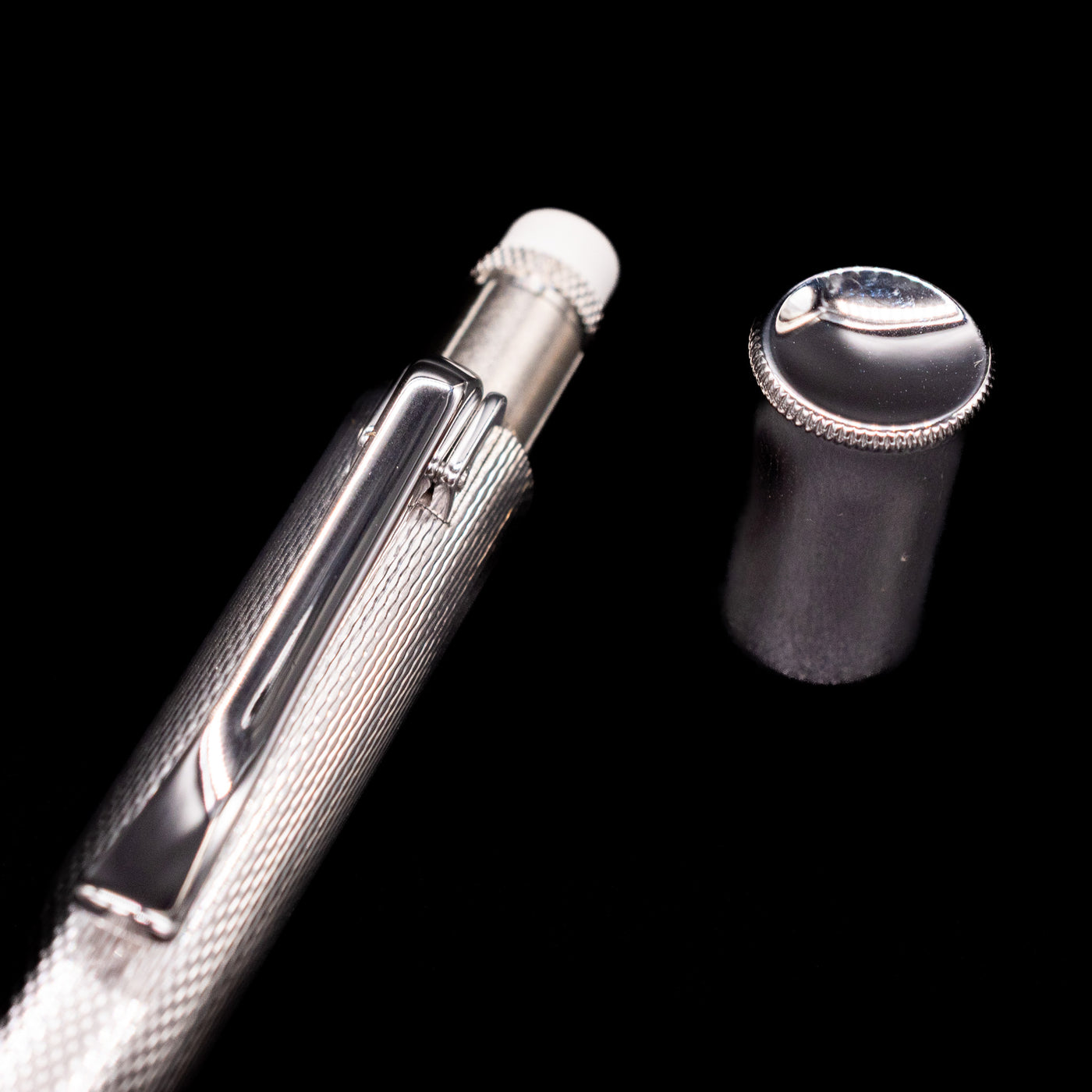 A close-up shot of the cap covering the eraser for the Graf von Faber-Castell Guilloche Mechanical Pencil - Barley Rhodium.