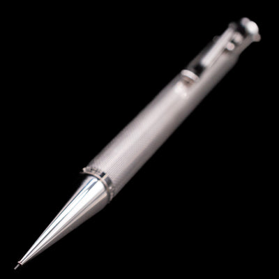 A full view of the Graf von Faber-Castell Guilloche Mechanical Pencil - Barley Rhodium with a focus on the tip.