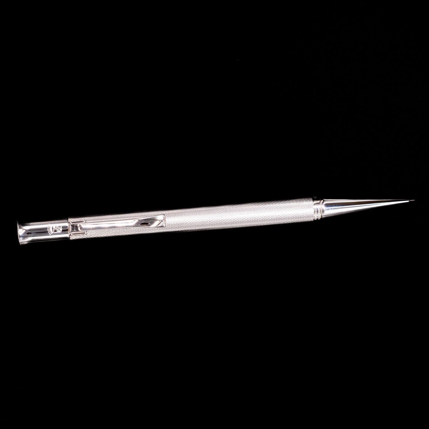 An overhead view of the Graf von Faber-Castell Guilloche Mechanical Pencil - Barley Rhodium.