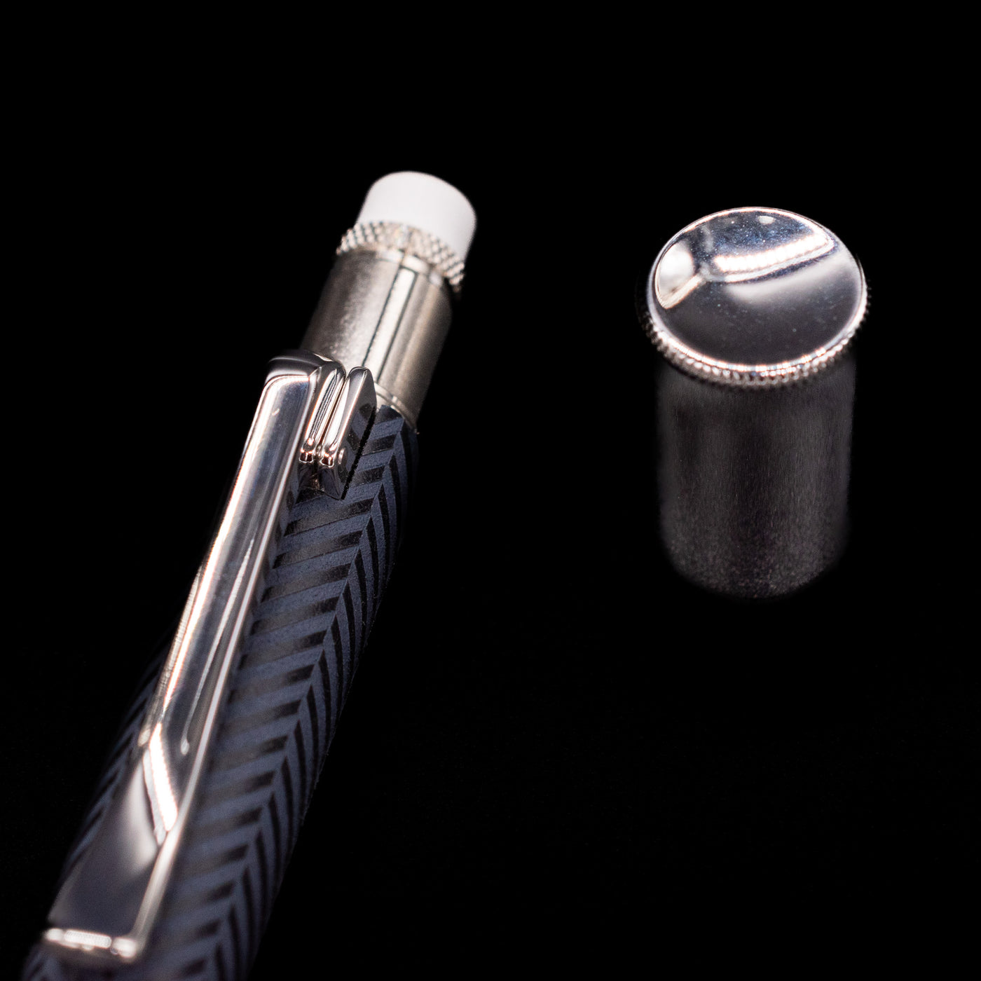 A close-up shot of the cap on the eraser for the Graf von Faber-Castell Guilloche Mechanical Pencil - Cisele Anthracite.