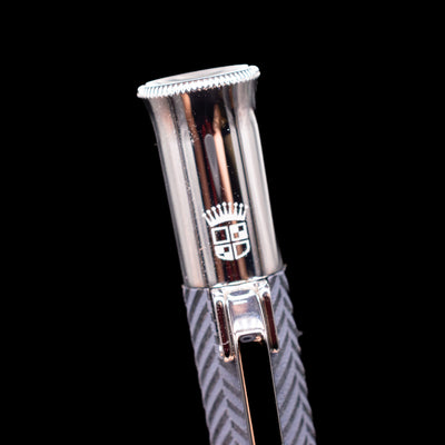 A macro shot of the logo on the cap for the Graf von Faber-Castell Guilloche Mechanical Pencil - Cisele Anthracite.