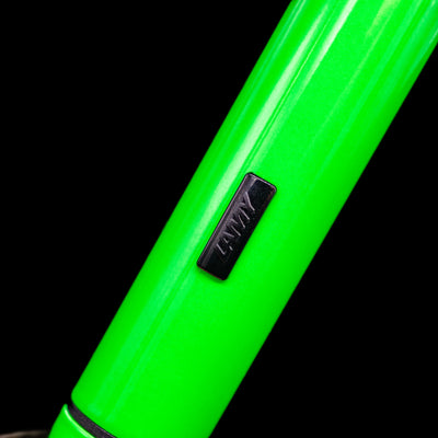 A macro shot of the LAMY Pico Ballpoint Pen - Neon Green showcasing the LAMY logo.