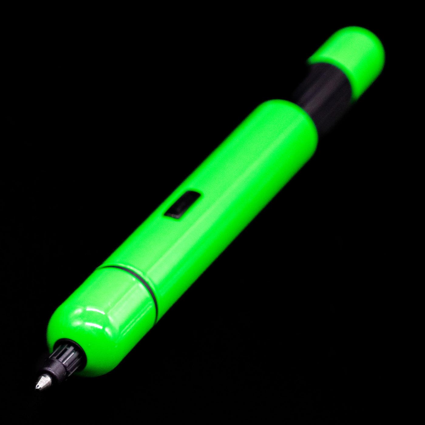 Full view of the LAMY Pico Ballpoint Pen - Neon Green opened up with a focus on the tip.