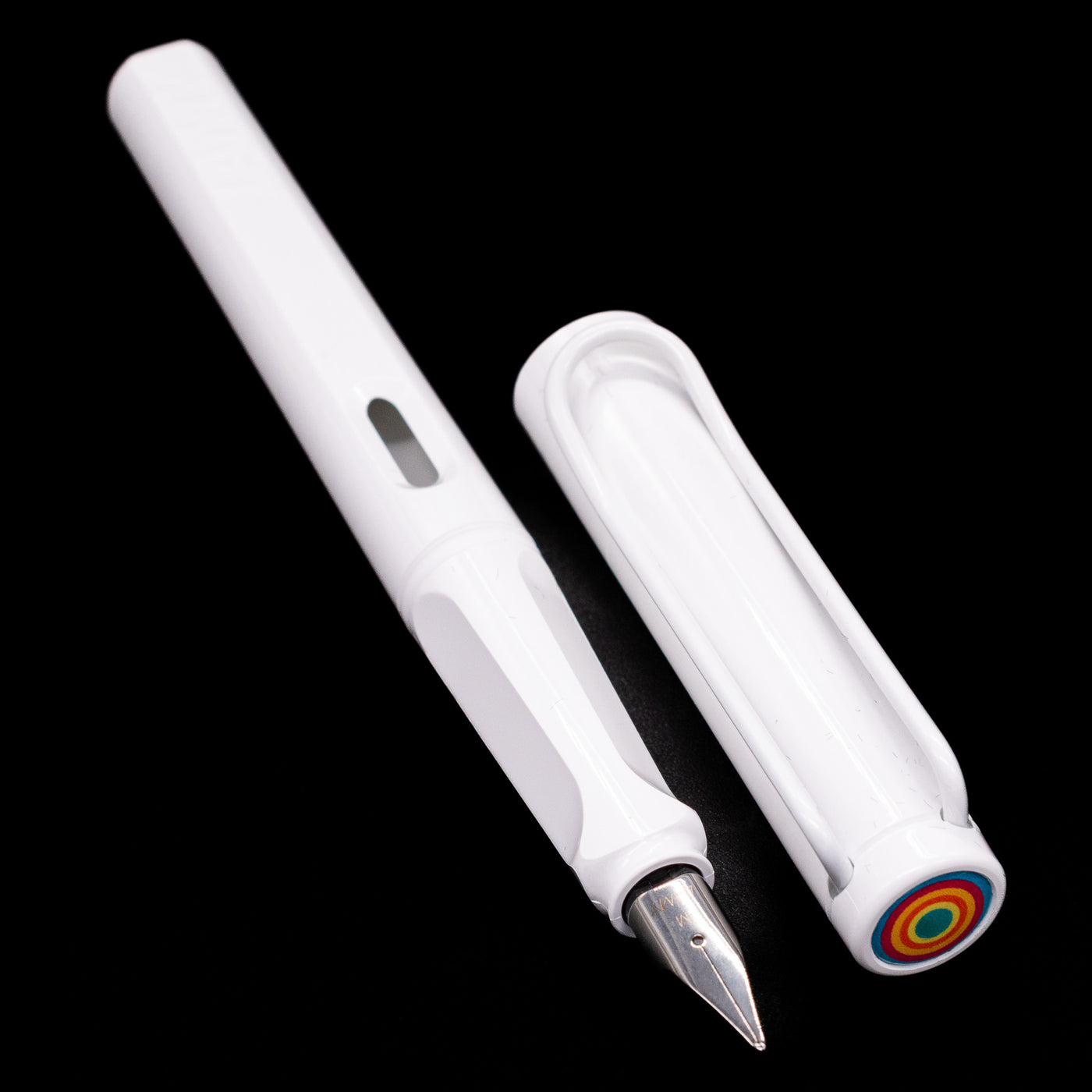 Full view of the uncapped LAMY Safari Multi Fountain Pen in glossy white, displaying its lightweight white barrel and comfortable triangular grip.