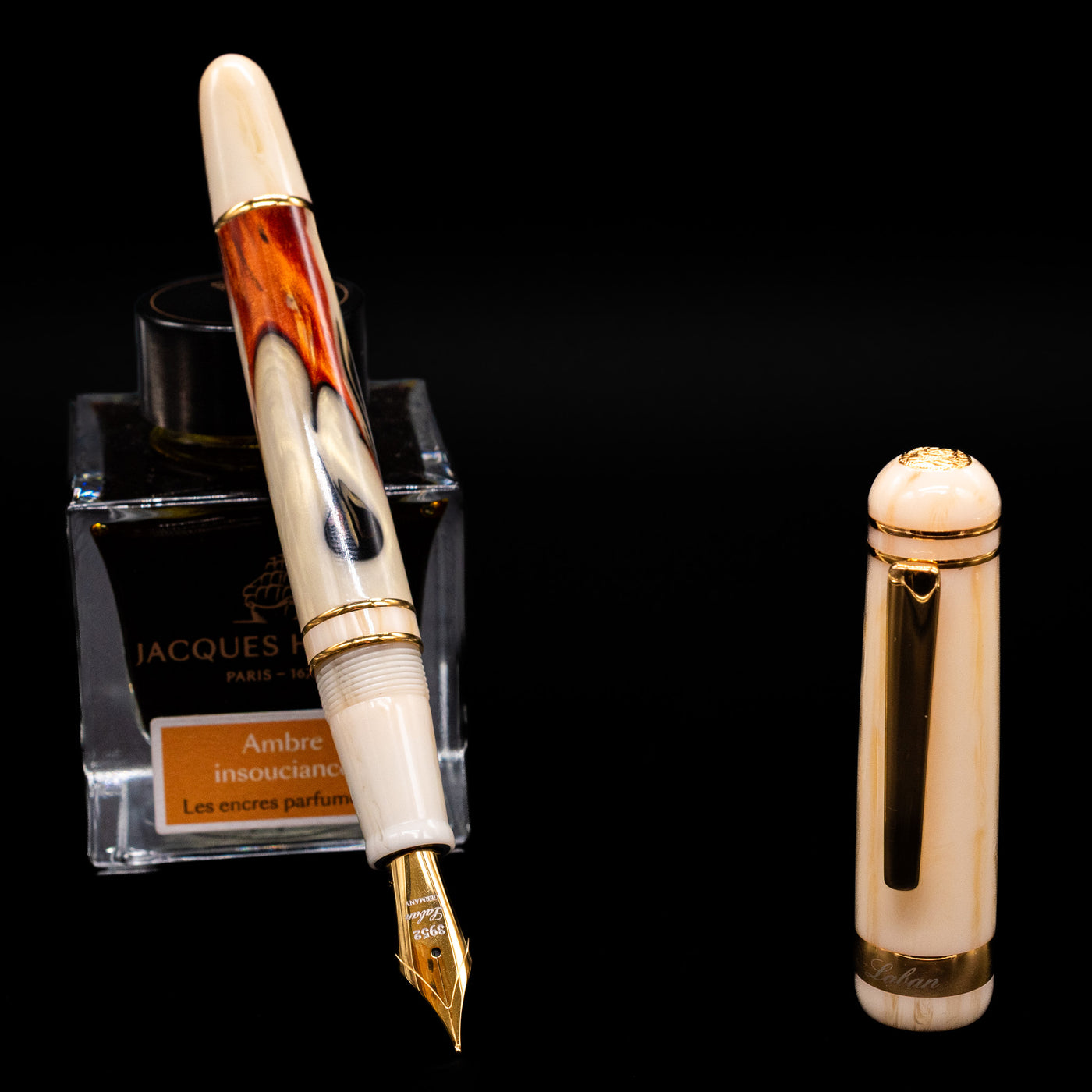 Laban 326 Fountain Pen - Desert Mirage leaning on an ink bottle uncapped showcasing the detailing on the nib.
