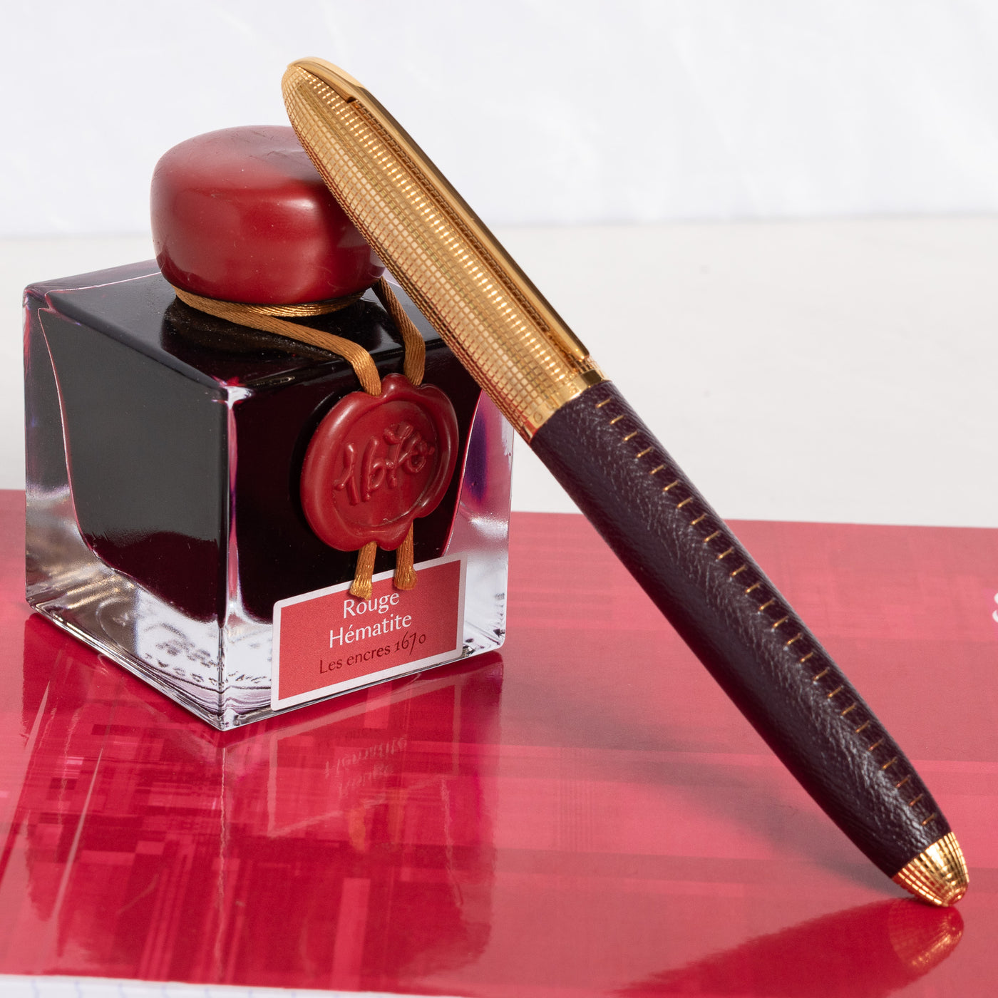Louis Vuitton Doc Burgundy Leather & Gold Rollerball Pen capped