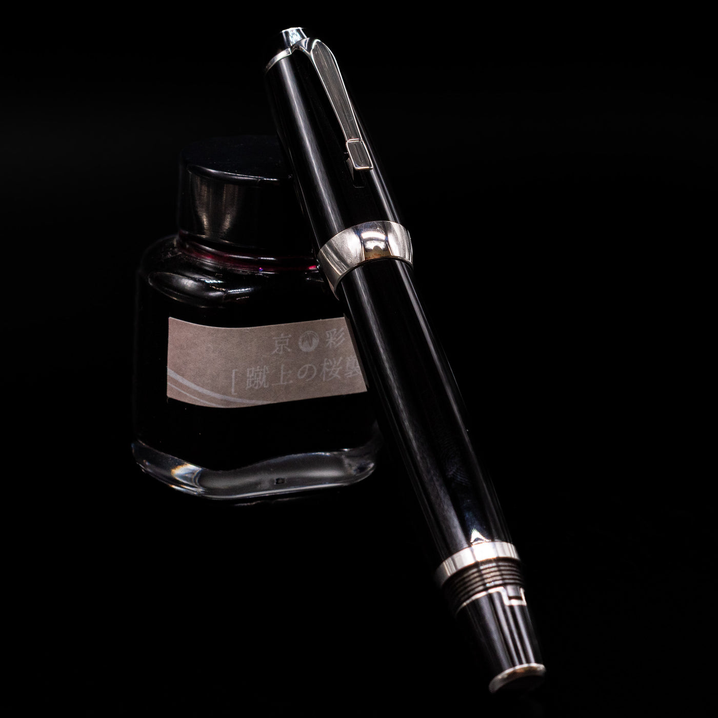 Montblanc Boheme Jumbo Large Fountain Pen - Preowned capped, leaning against an ink bottle. 